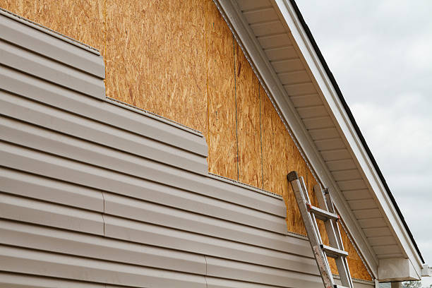 Professional Storm Damage Siding Repair technician working in Danville, PA